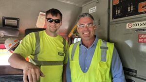 Rep. Wied smiles with the locomotive engineer leading the tour as he turned out to be a distant relative of the Congressman.