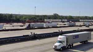 Outbound UPS trucks leave the facility, which will see even more activity during peak season.

